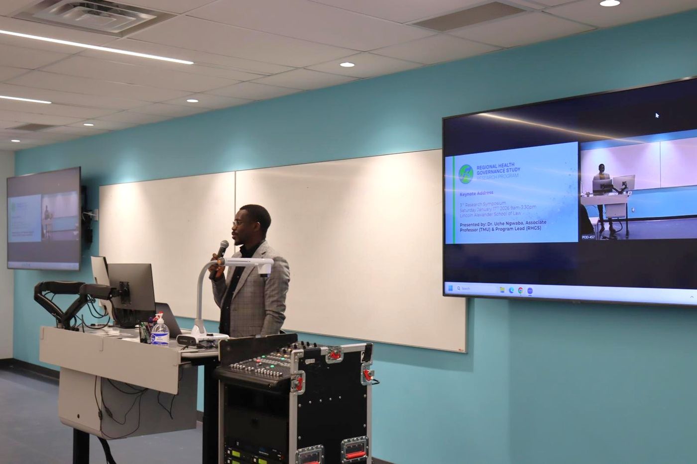 A speaker presenting at the RHGS symposium